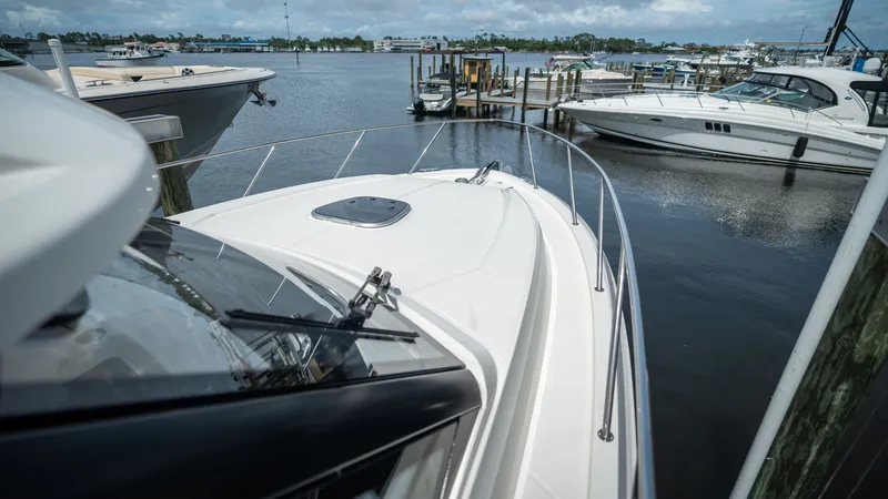 Slide: The Image of Boston Whaler 365 Conquest 2026 docked, surrounded by other boats. - 9