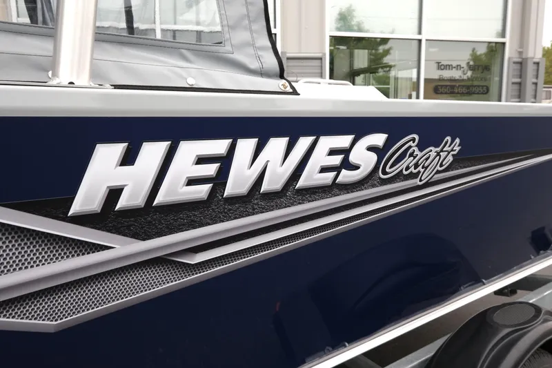 Slide: The Image of 2025 Hewescraft 200 Sportsman boat with sleek design and logo detail. - 15