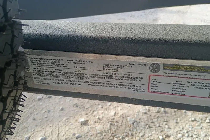 Slide: The Image of Label on a 2026 SunCatcher Select 18F trailer, showing specifications and tire information. - 11