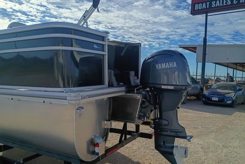 Slide: The Image of 2026 SunCatcher Select 18F pontoon boat with Yamaha outboard motor at dealership. - 3