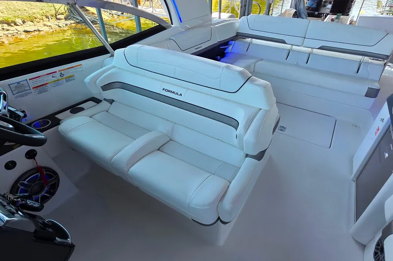 Slide: The Image of 2026 Formula 350 Crossover Bowrider I/O interior with luxurious white seating and modern design. - 18
