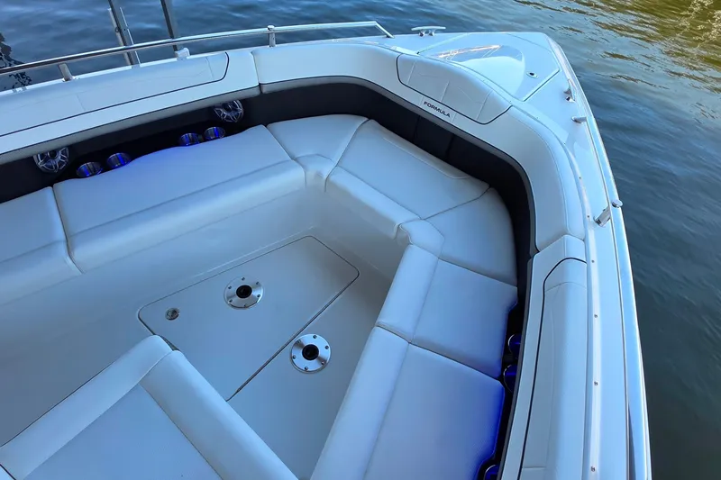 Slide: The Image of 2026 Formula 350 Crossover Bowrider I/O with spacious seating and sleek design on water. - 21