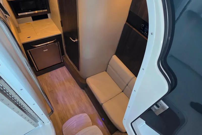 Slide: The Image of Interior of 2026 Formula 350 Crossover Bowrider I/O with kitchenette and seating area. - 23