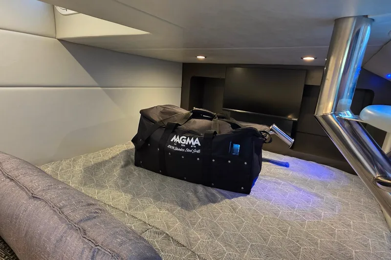 Slide: The Image of Interior of 2026 Formula 350 Crossover Bowrider I/O with Magma bag on bed. - 28