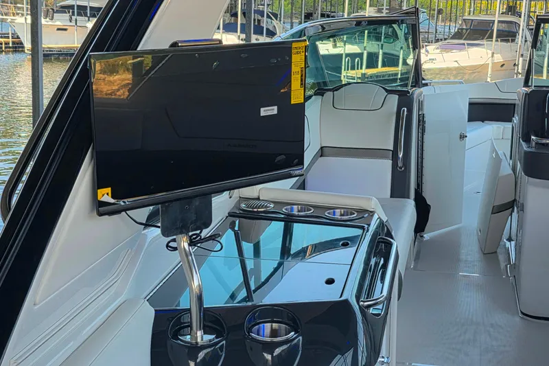 Slide: The Image of 2026 Formula 350 Crossover Bowrider I/O interior with TV and seating area. - 31