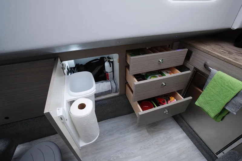 Slide: The Image of Manufacturer Provided Image: Interior of 2026 Formula 350 Crossover Bowrider I/O with open storage drawers and cabinet. - 43