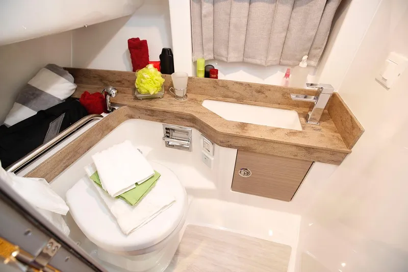 Slide: The Image of Manufacturer Provided Image: 2026 Formula 350 Crossover Bowrider I/O bathroom with modern sink and compact design. - 45