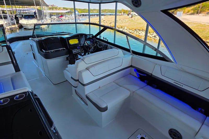 Slide: The Image of 2026 Formula 350 Crossover Bowrider I/O interior with modern seating and navigation system. - 8