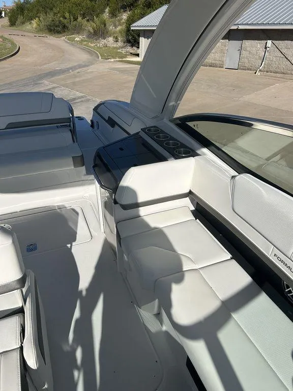 Slide: The Image of 2025 Formula 310 Bowrider interior with sleek seating and modern dashboard design. - 13