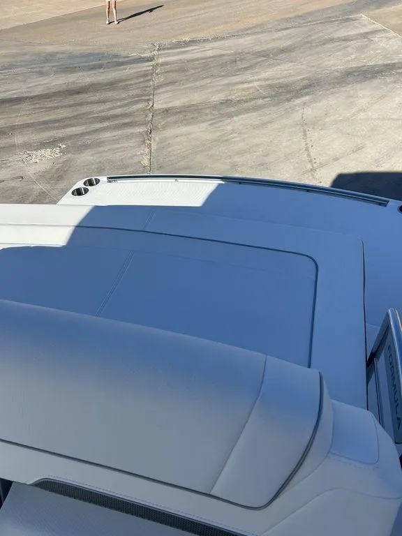 Slide: The Image of 2025 Formula 310 Bowrider boat on a concrete surface, partial view. - 17