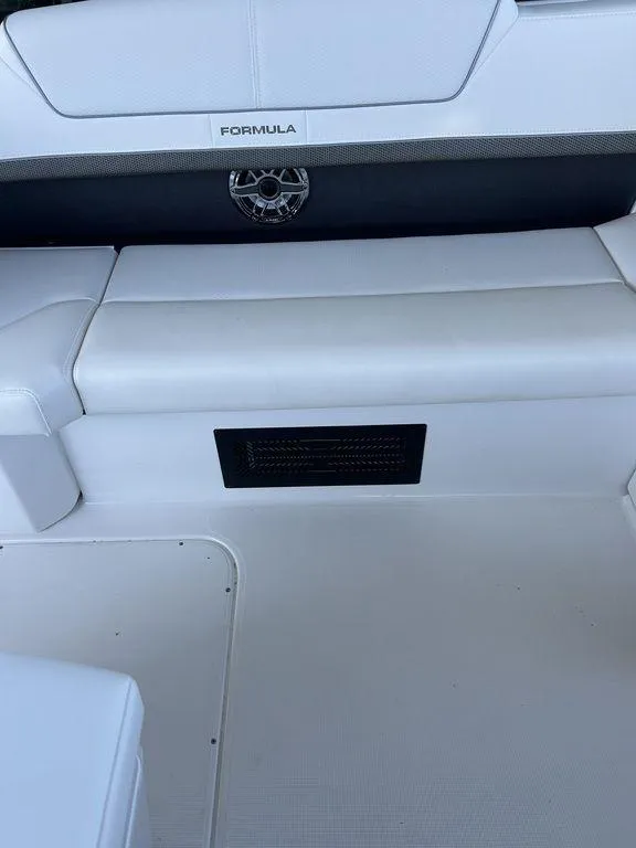Slide: The Image of 2025 Formula 310 Bowrider interior seating with sleek white upholstery. - 22