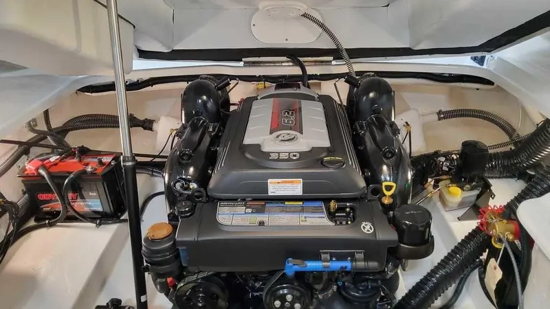 Slide: The Image of Engine compartment of 2025 Formula 240 Bowrider, featuring a powerful 350 engine. - 10