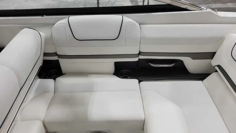 Slide: The Image of 2025 Formula 240 Bowrider interior with white leather seating and modern design. - 12