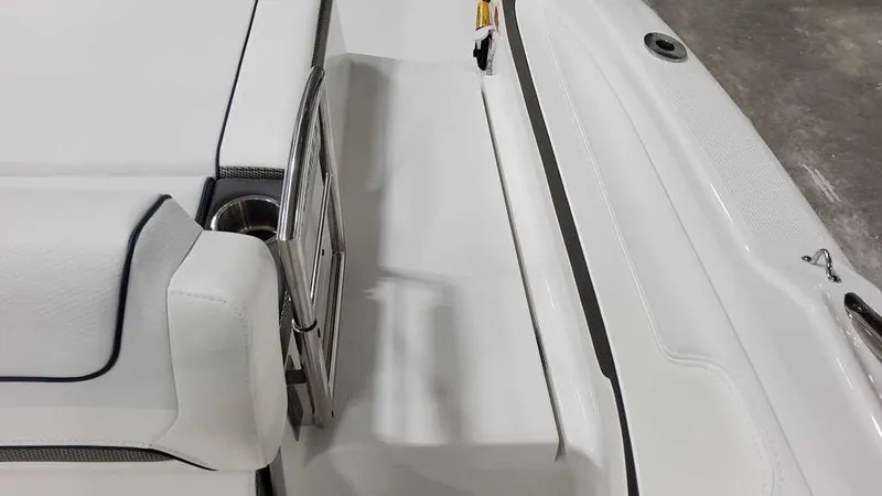 Slide: The Image of 2025 Formula 240 Bowrider interior detail, featuring sleek white seating and stainless steel accents. - 15