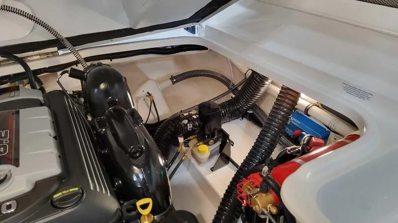 Slide: The Image of Engine compartment of 2025 Formula 240 Bowrider boat, showcasing mechanical components. - 8
