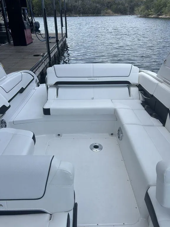 Slide: The Image of 2025 Formula 290 Bowrider at dock, calm water view. - 10