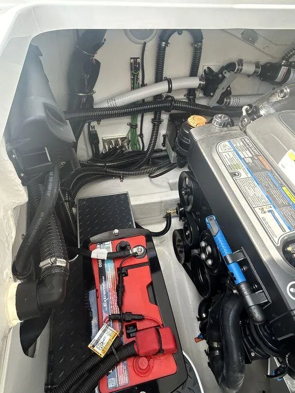 Slide: The Image of 2025 Formula 290 Bowrider engine compartment with Mercury engine components. - 28