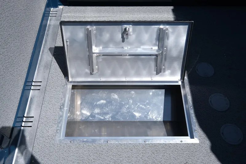 Slide: The Image of Open storage compartment on 2025 Hewescraft 210 Sea Runner ET boat. - 15