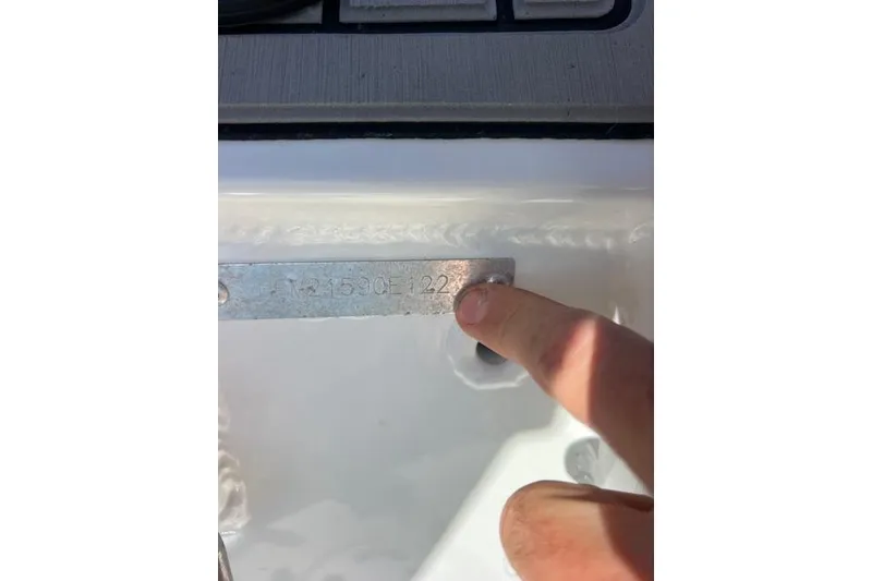 Slide: The Image of Close-up of a 1997 Sea Ray 450 Sundancer hull identification number plate. - 12