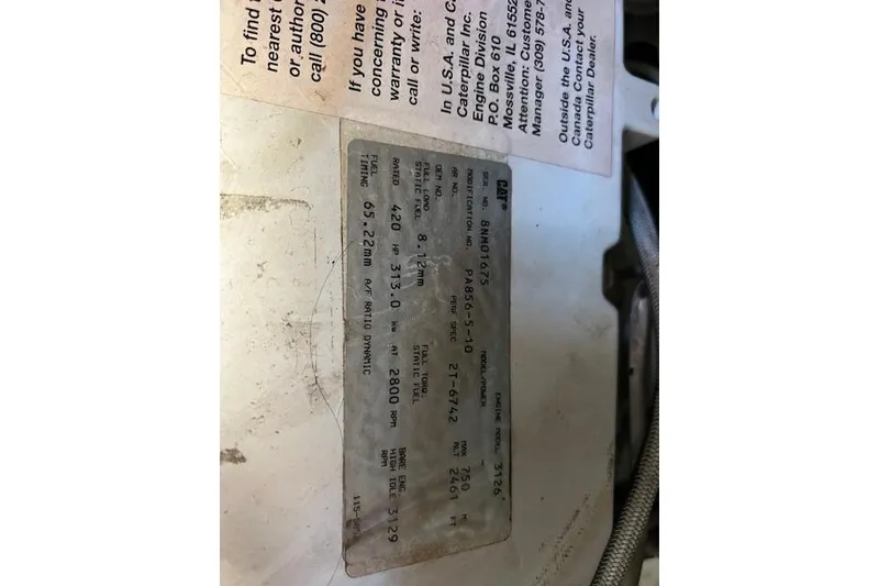 Slide: The Image of Label on a 1997 Sea Ray 450 Sundancer engine with technical specifications. - 53