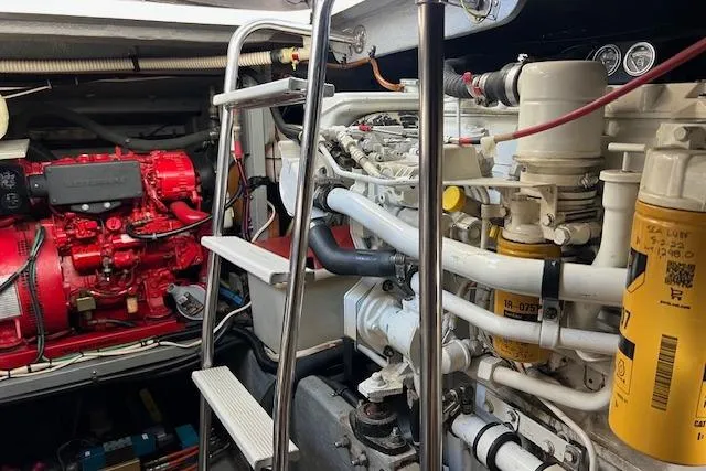 Slide: The Image of Engine room of a 1997 Sea Ray 450 Sundancer with visible machinery and components. - 55