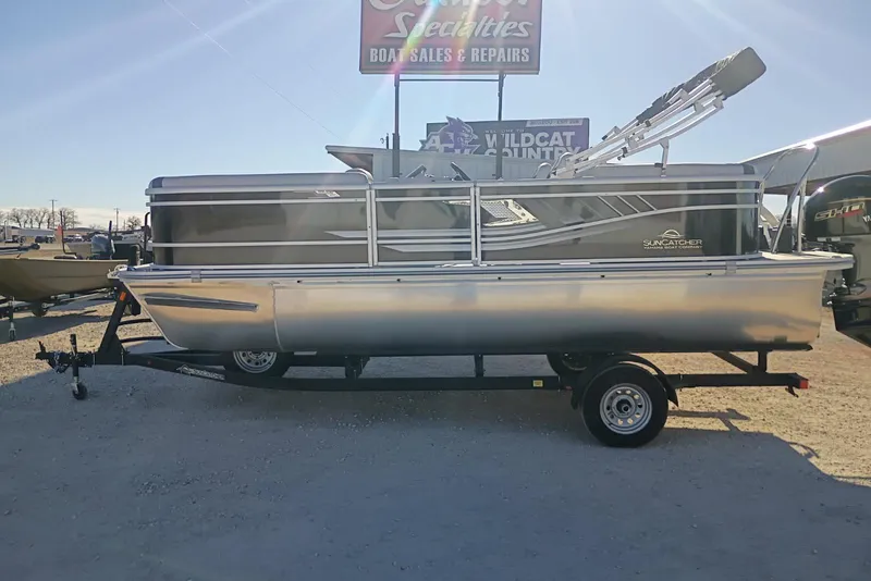 Slide: The Image of 2026 SunCatcher Select 20RC pontoon boat on trailer at dealership. - 10