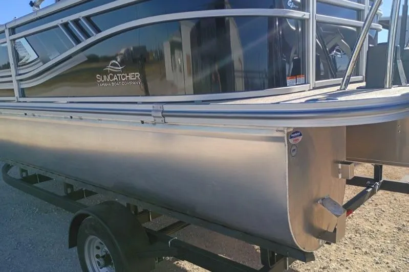 Slide: The Image of 2026 SunCatcher Select 20RC pontoon boat on trailer, side view. - 12