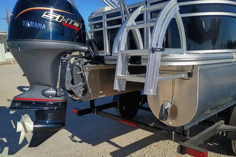 Slide: The Image of 2026 SunCatcher Select 20RC pontoon boat with Yamaha outboard motor and aluminum ladder. - 5