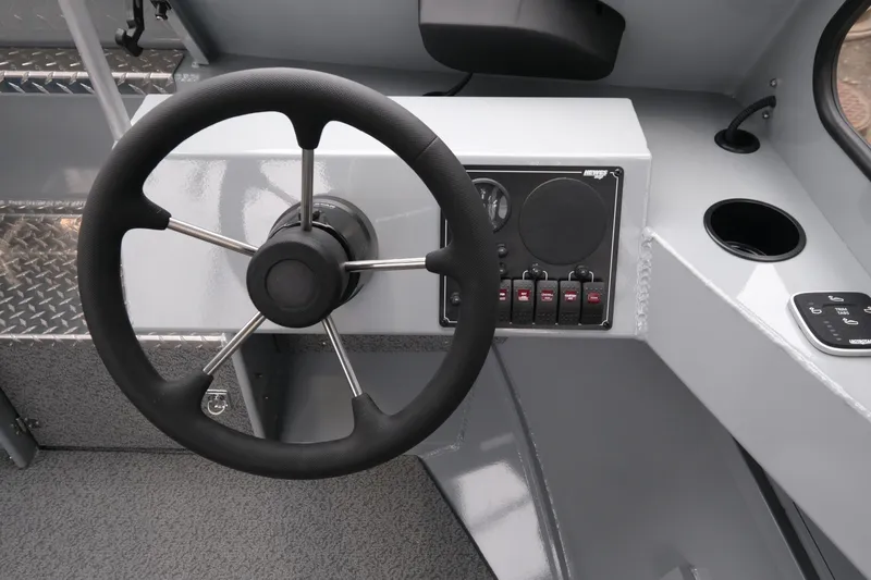 Slide: The Image of Steering console of 2026 Hewescraft 180 ProV ET boat with control panel. - 11