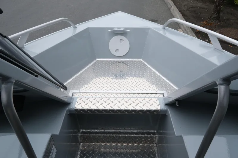 Slide: The Image of 2026 Hewescraft 180 ProV ET boat interior with diamond plate flooring. - 12