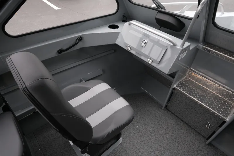 Slide: The Image of Interior of 2026 Hewescraft 180 ProV ET boat, featuring seating and storage compartments. - 13