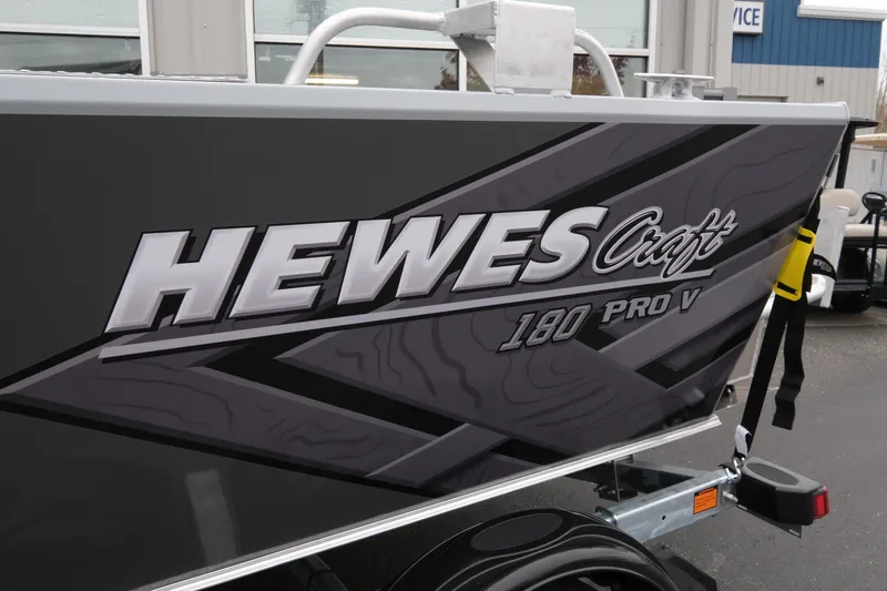 Slide: The Image of 2026 Hewescraft 180 ProV ET boat with sleek gray design and bold branding. - 15