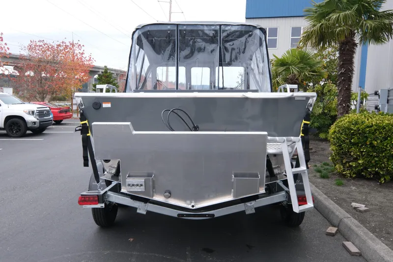 Slide: The Image of 2026 Hewescraft 180 ProV ET boat, rear view in a parking lot. - 4