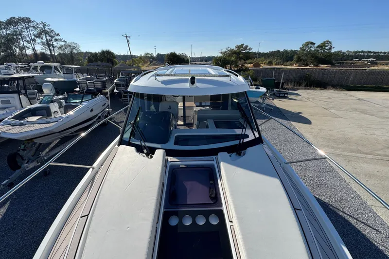 Slide: The Image of 2020 Beneteau Antares 27 boat on display in a marina setting. - 21