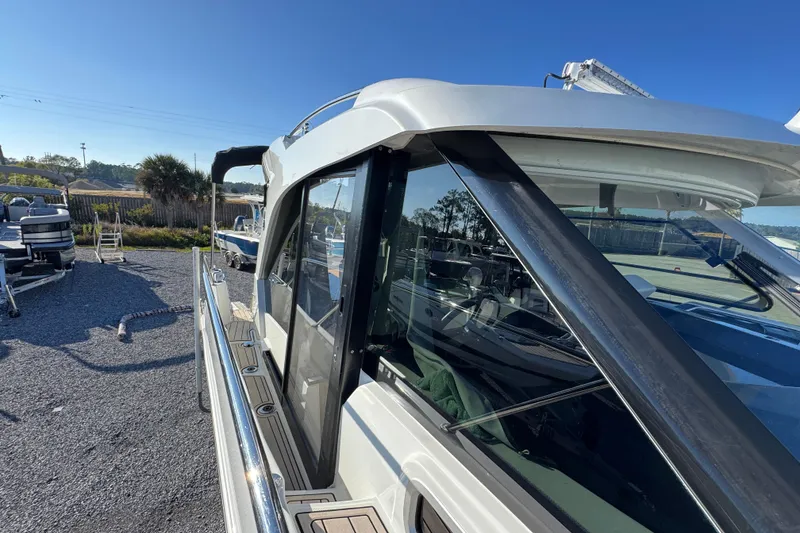 Slide: The Image of 2020 Beneteau Antares 27 boat docked, showcasing sleek design and modern features. - 24