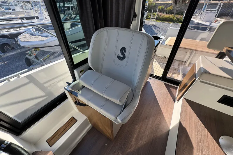 Slide: The Image of Captain's chair on 2020 Beneteau Antares 27 boat, featuring sleek design and comfortable seating. - 31
