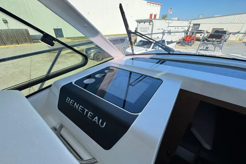 Slide: The Image of Interior view of 2020 Beneteau Antares 27 boat dashboard with logo. - 34