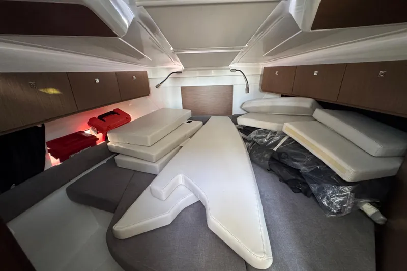 Slide: The Image of Interior cabin of 2020 Beneteau Antares 27 with cushions and storage cabinets. - 41