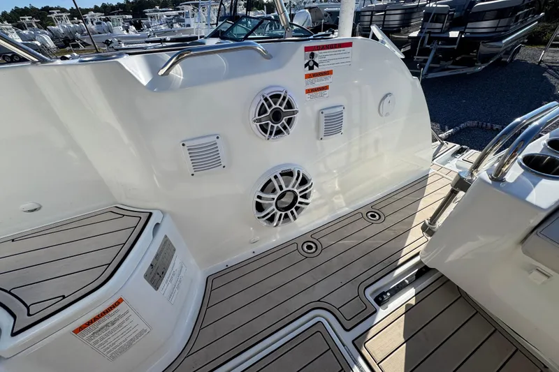 Slide: The Image of 2020 Beneteau Antares 27 boat deck with speakers and warning labels. - 47