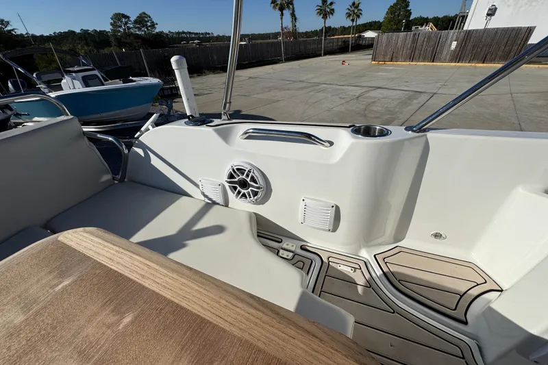 Slide: The Image of Interior view of 2020 Beneteau Antares 27 boat, featuring seating and speaker system. - 48