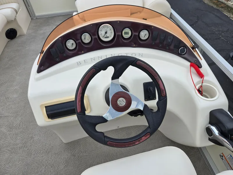 Slide: The Image of Steering console of a 2007 Bennington 2075GL boat with gauges and controls. - 19