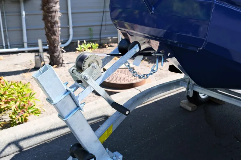 Slide: The Image of Boat trailer winch system on Fish Whistle FW109, 2023 model, in outdoor setting. - 11