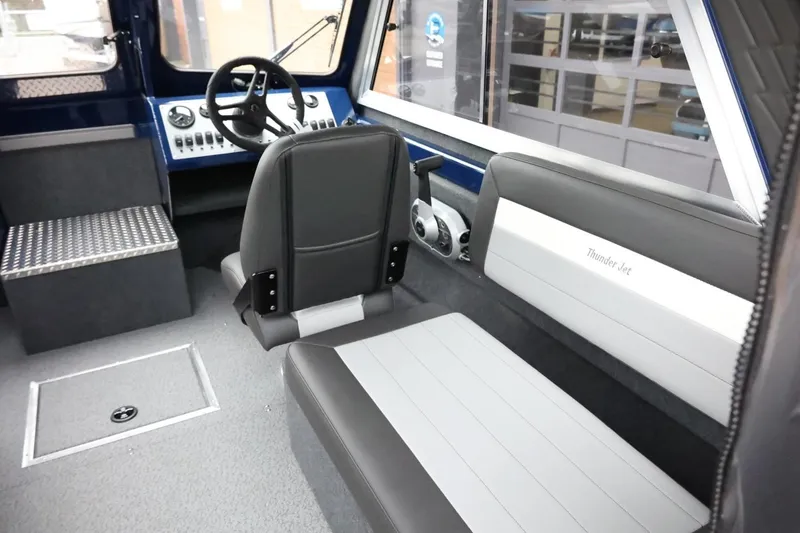 Slide: The Image of Interior of 2026 Thunder Jet 185 Luxor boat with steering wheel and seating. - 13