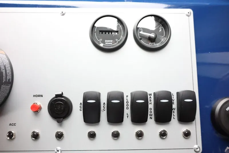 Slide: The Image of Control panel of 2026 Thunder Jet 185 Luxor boat with switches and gauges. - 23