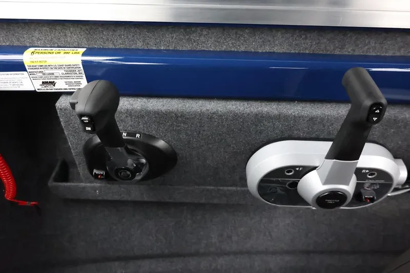 Slide: The Image of 2026 Thunder Jet 185 Luxor boat controls with dual throttle levers and capacity label. - 24
