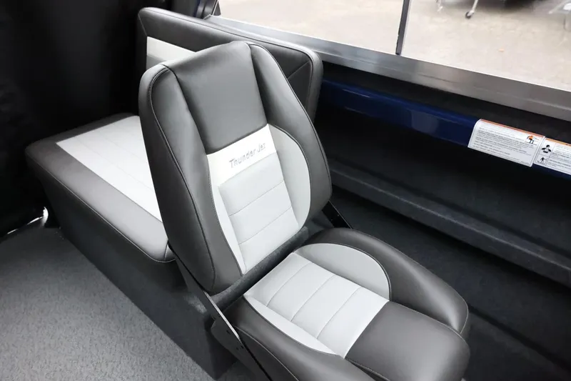 Slide: The Image of 2026 Thunder Jet 185 Luxor interior seating, featuring gray and white cushioned seats. - 29