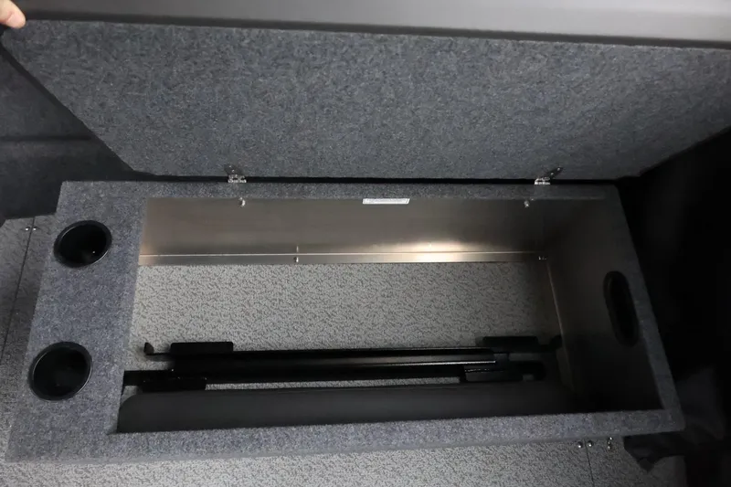 Slide: The Image of Storage compartment in 2026 Thunder Jet 185 Luxor boat, featuring carpeted interior and cup holders. - 30