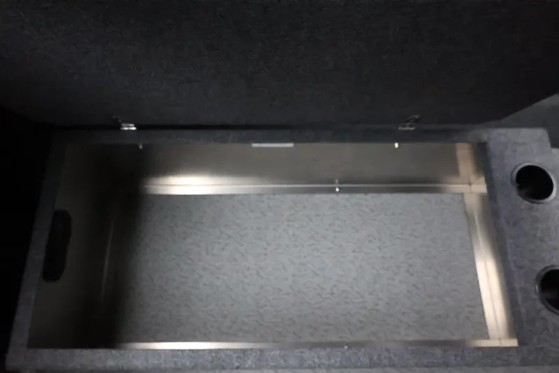 Slide: The Image of Storage compartment in 2026 Thunder Jet 185 Luxor boat, featuring carpeted interior and cup holders. - 31