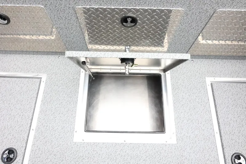 Slide: The Image of 2026 Thunder Jet 185 Luxor boat storage compartment with diamond plate lids. - 33