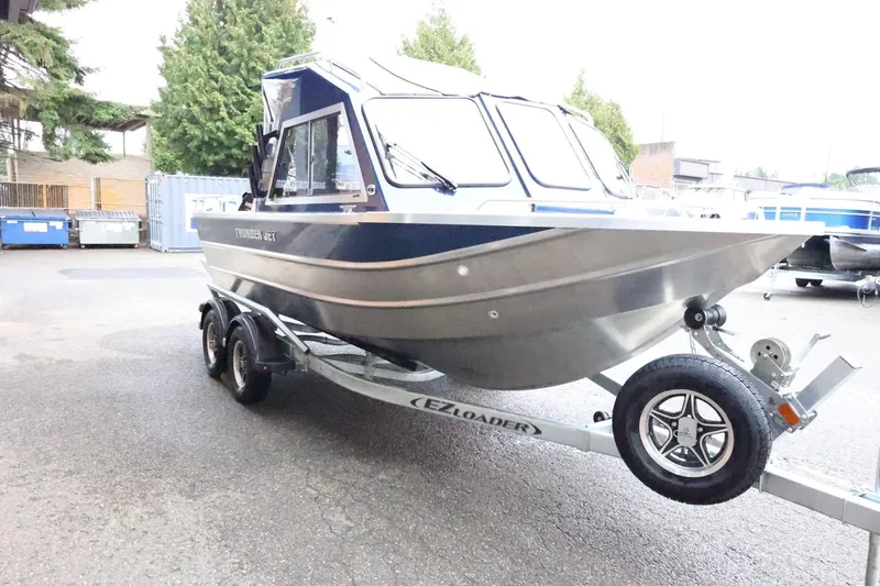 Slide: The Image of 2026 Thunder Jet 185 Luxor boat on trailer in outdoor setting. - 4